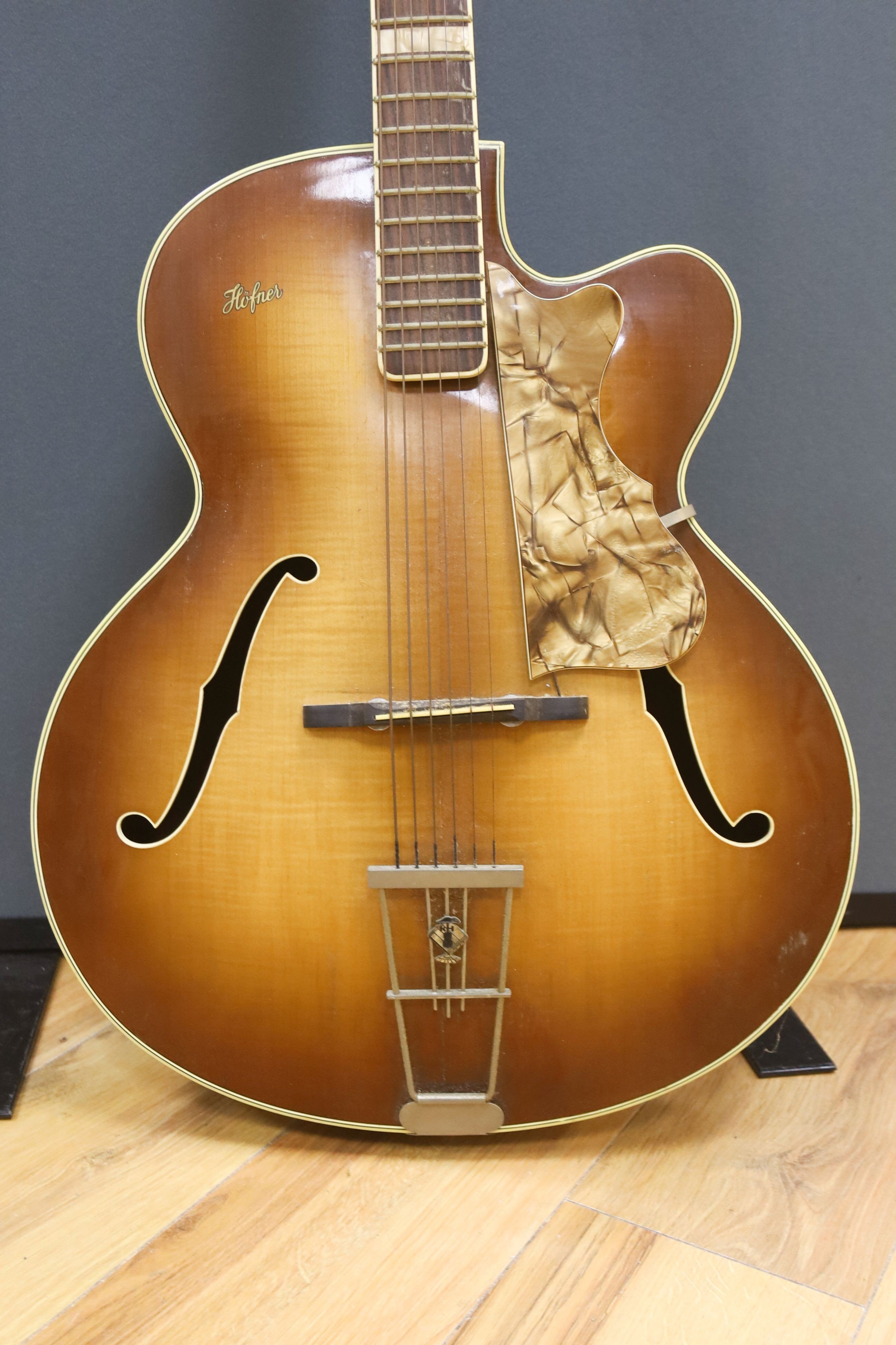 A Hofner acoustic f-hole guitar, circa 1950, having mother of pearl and tortoiseshell inlay to fret and head